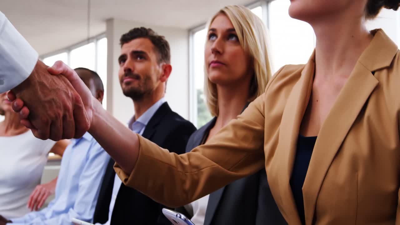 Business executives using mobile phone and digital tablet