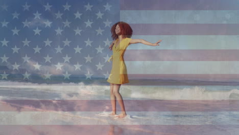 animation of american flag and clouds over african american woman dancing on sunny beach