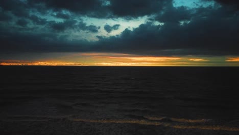 amazing cinematic nusa dua beach air footage with exotic sunset, cloud and wave in full hd 1080p.