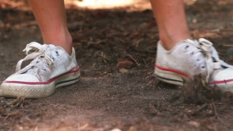 Girl-playing-with-mud-in-park