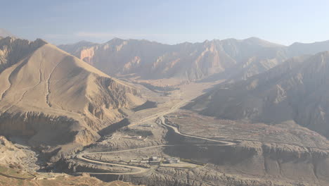 Looking-down-on-the-village-of-Ghami-in-the-Upper-Mustang-region-of-Nepal,-Asia