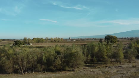 Vast-Green-Plains-And-A-Distant-View-Of-Alaverdi-Church-In-Kakheti-Region-Of-Eastern-Georgia