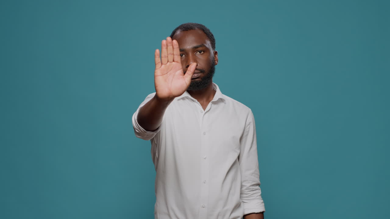 Man gesturing stop with hand