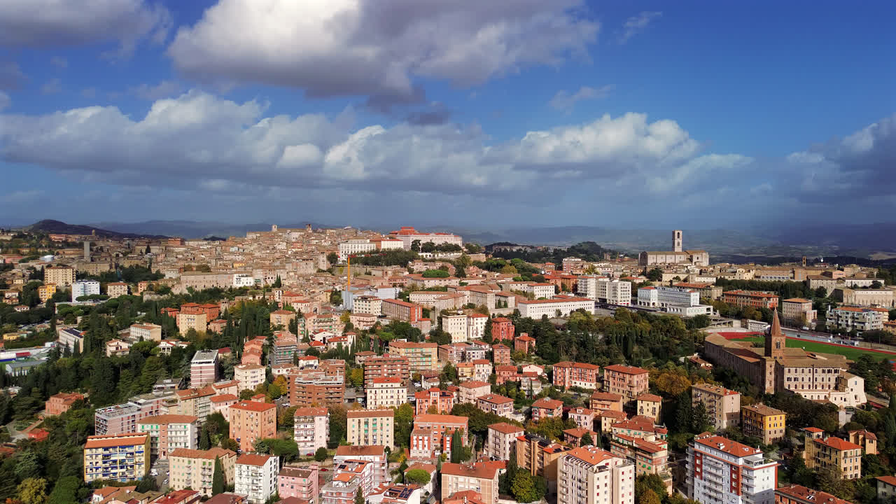 Drone Perugia city rooftops and cathedral with italian renaissance urban layout, pan