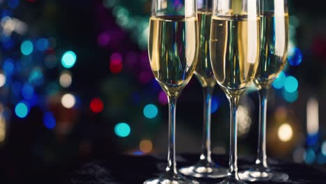 Glasses-of-champagne-against-the-background-of-blurred-festive-lights