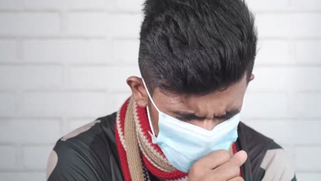 sick man wearing mask