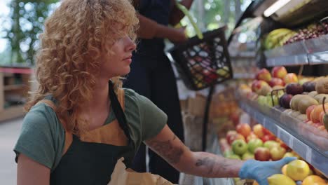 people shopping for produce at a supermarket