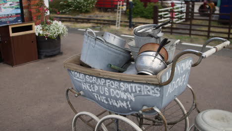 pots and pans scrap metal collection for spitfires during world war two at a british train station