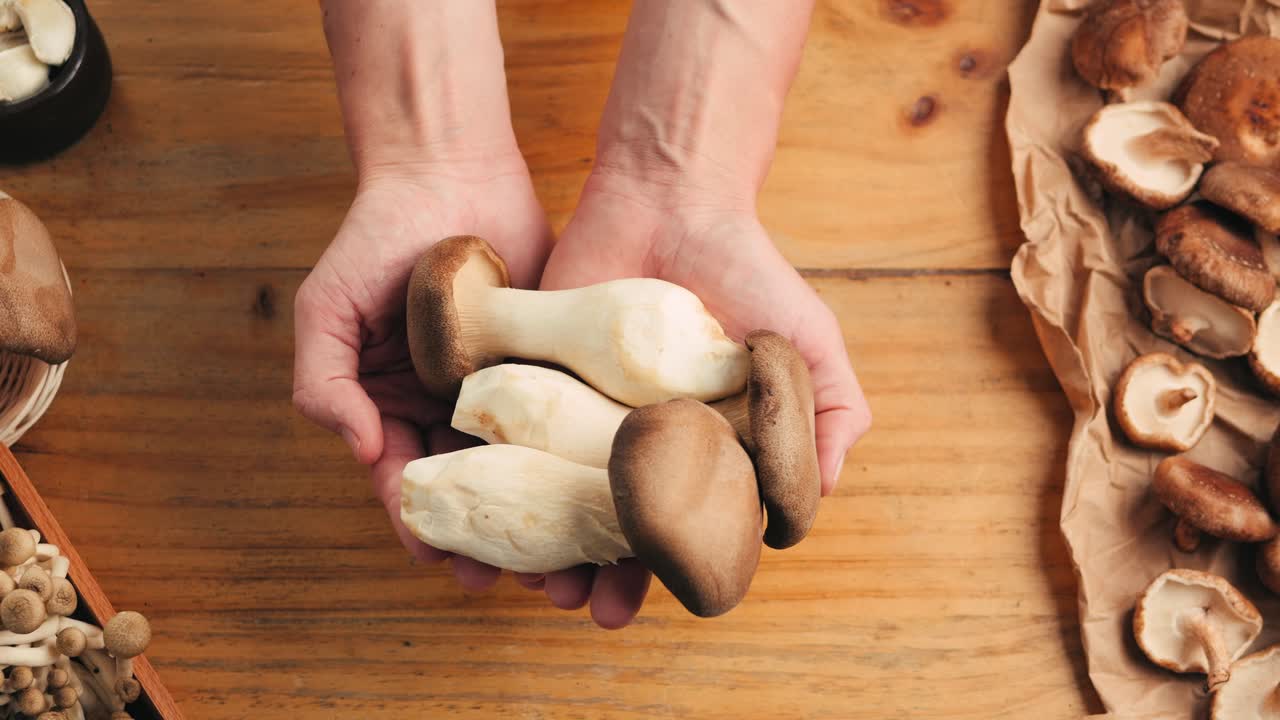 Hands Holding Fresh Mushrooms