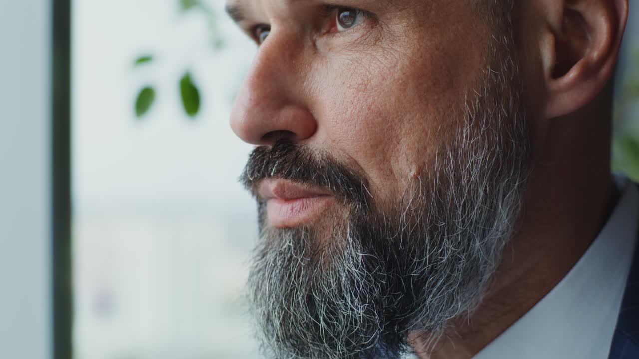 Close-up of a Man Looking out a Window