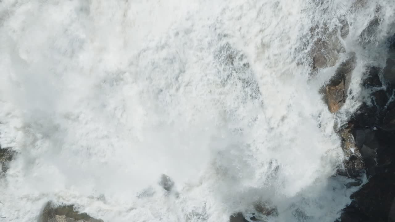 Powerful waterfall cascading over rocks in Owen Sound, Canada, aerial view