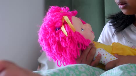 child playing with a doll