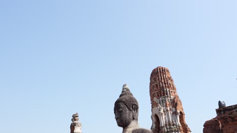 Stone-Buddha-tilt-shot-at-Thailand-temple-Wat-Maha-That-ว-ดมหาธาต