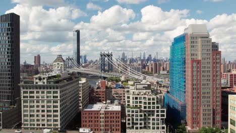 new york city skyline with manhattan bridge in foreground, 4k drone shot