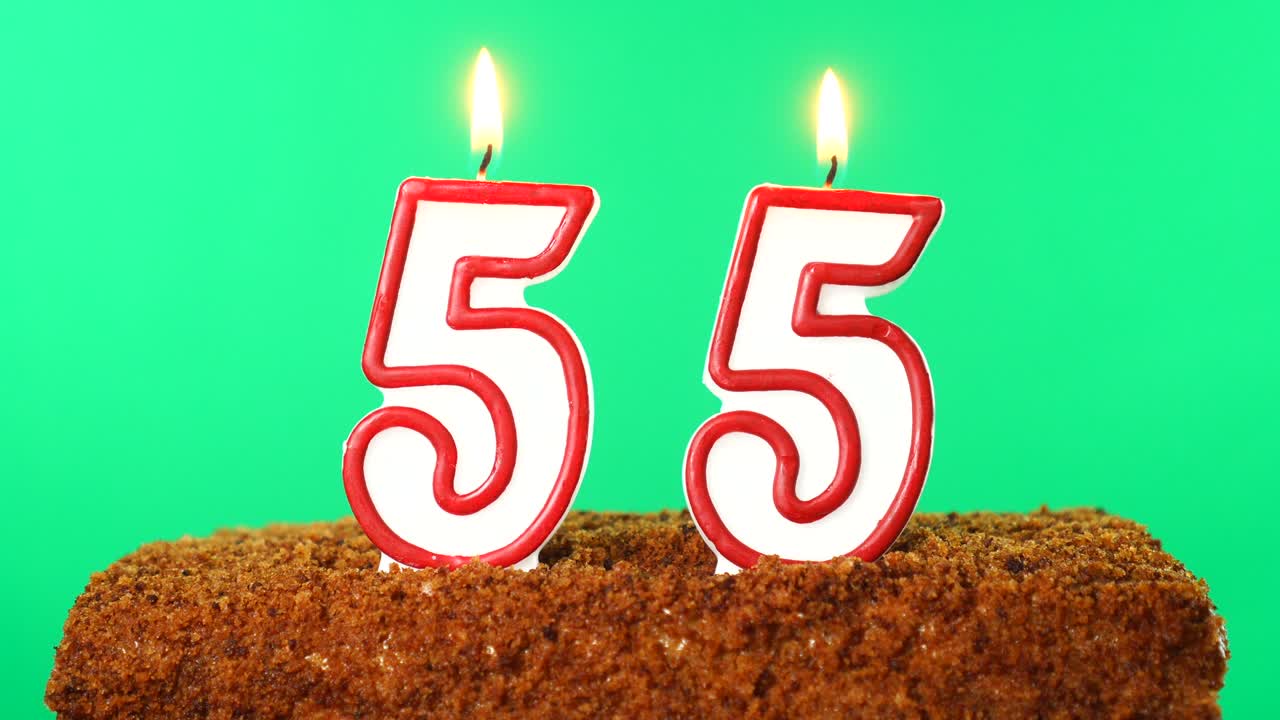 Cake with the number 55 lighted candle. Chroma key. Green Screen. Isolated