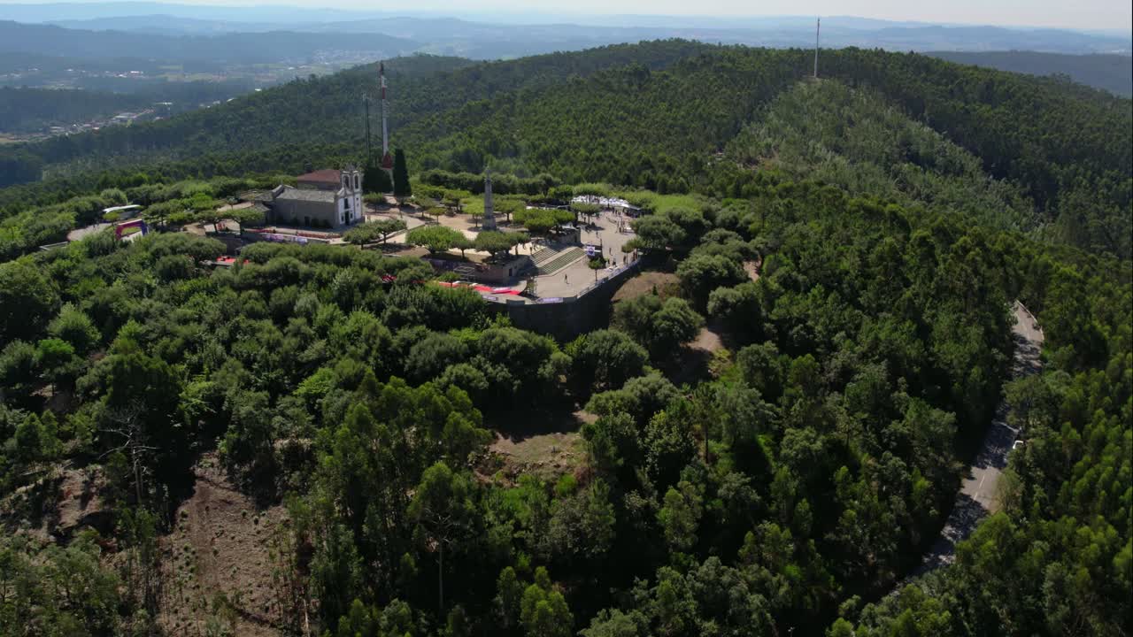 Aerial - Monte da Franqueira, Barcelos, hilltop structures amidst dense green forest