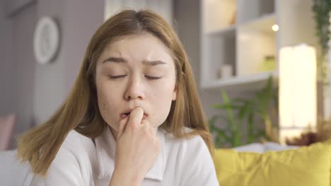 the young girl is thoughtful and uneasy at home.