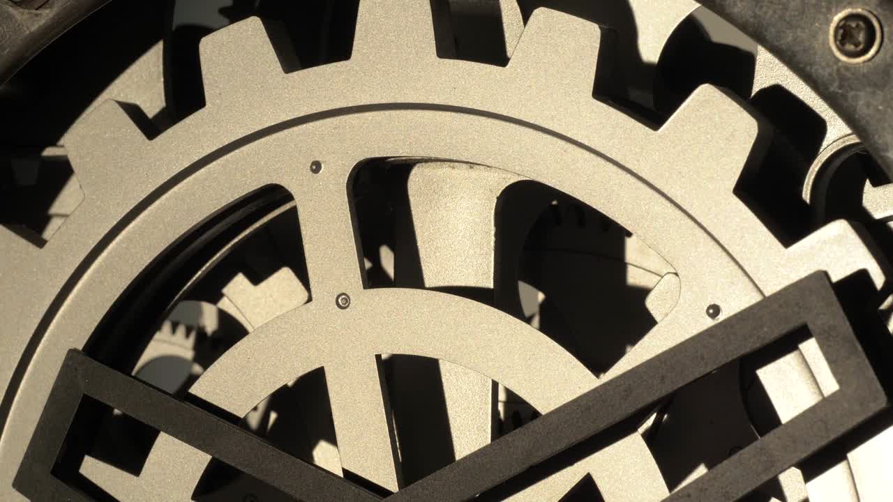 Close up cogwheels of an industrial looking clock