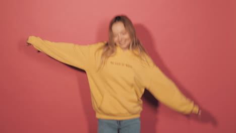 happy woman in a yellow hoodie