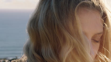 portrait-of-happy-woman-laughing-having-fun-on-summer-vacation-enjoying-seaside-at-sunset-with-wind-blowing-hair