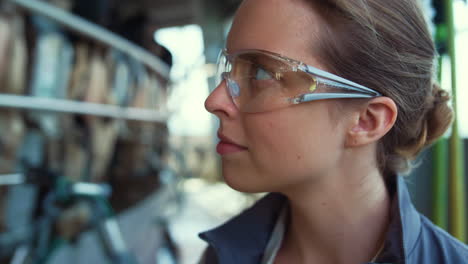 livestock farmer check milking automatic process in protective glasses closeup.