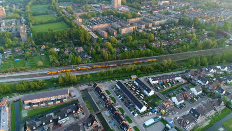 ns train traveling within gouda city in south holland, netherlands