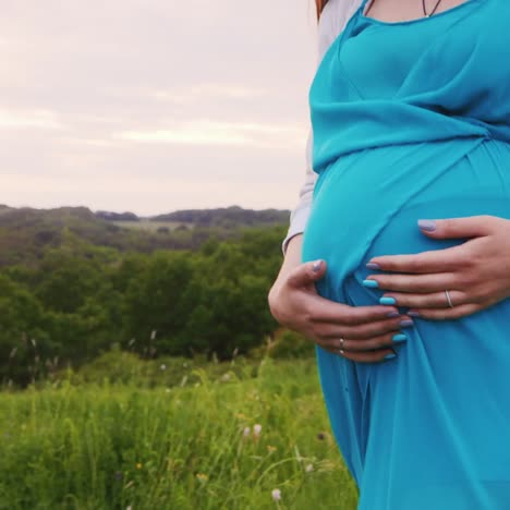 pregnant woman walking at sunset