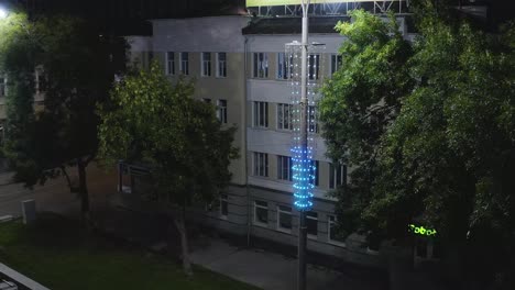 city street at night with illuminated lamppost