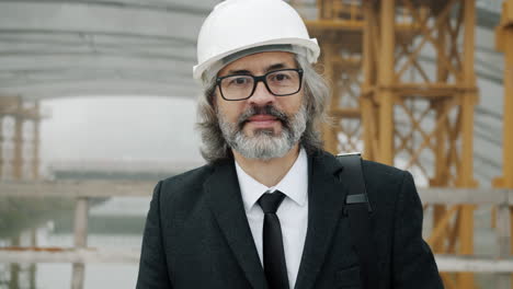 engineer in a business suit at construction site