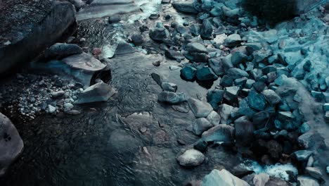 gorgeous overhead aerial drone shot of a crystal clear blue river