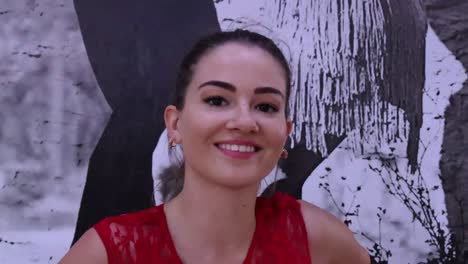 young woman in red and black dress dancing