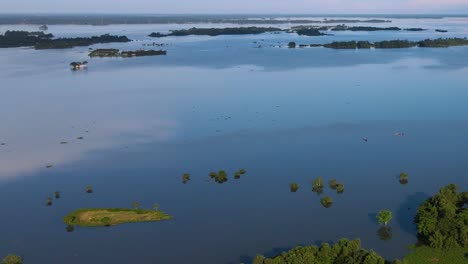 aerial tilt up view over large flooded rural landscape plains in sylhet