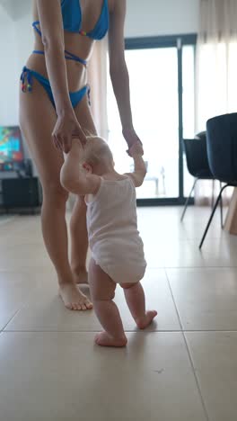 mother and baby learning to walk