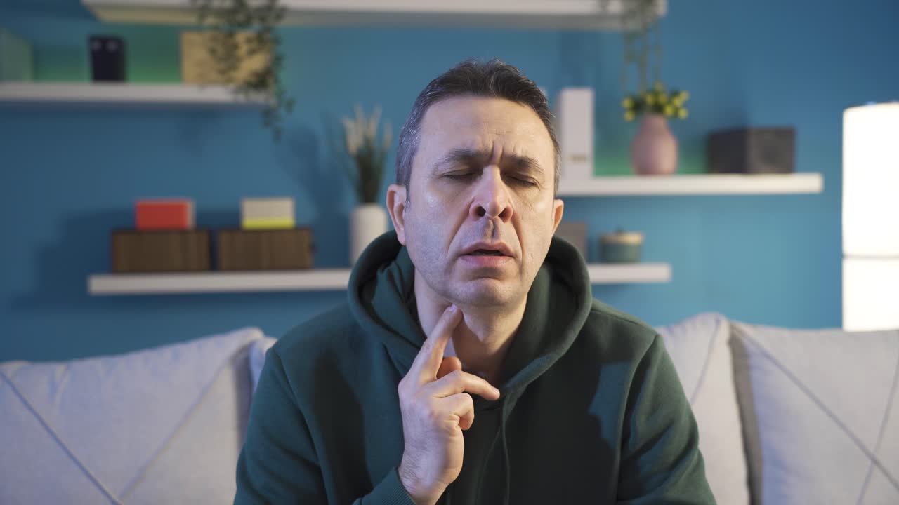 Man with sore throat can't swallow, goiter.