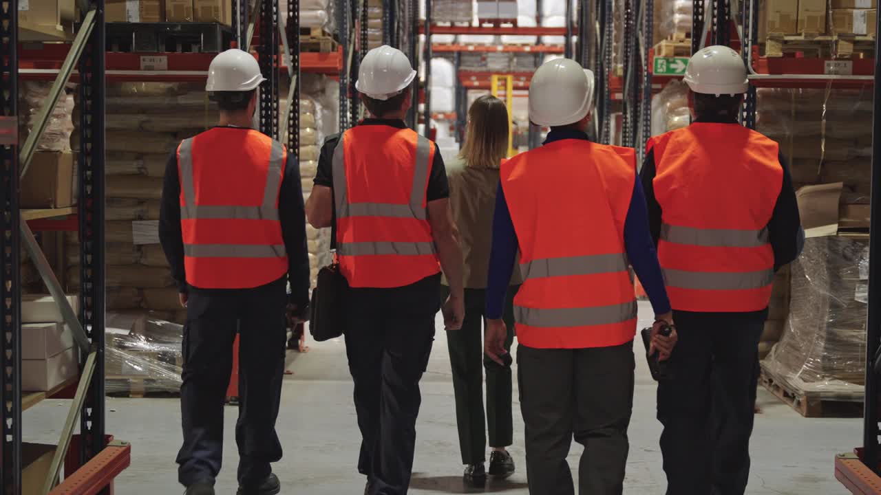Warehouse workers in safety gear