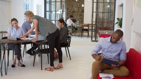 young professionals working together in an open plan office