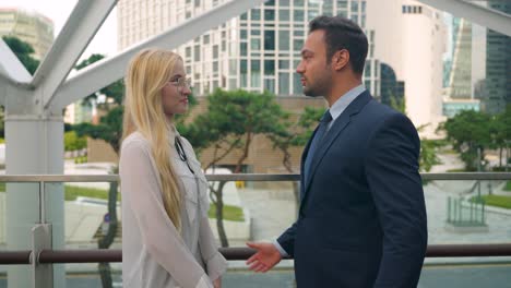 business people meeting outdoors in a city