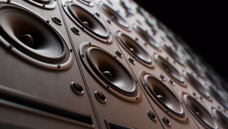 playing cabinet speakers stacked on a concert stage in form of an endless wall pattern. powerful, versatile stage equipment lit by a spotlight, creating a moody and climatic music festival atmosphere.