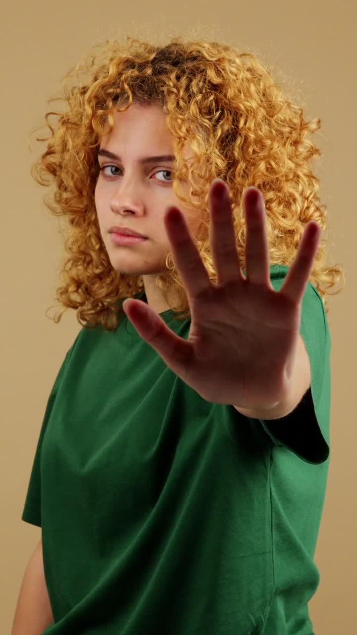 Young Woman Making a Stop Gesture with Her Hand