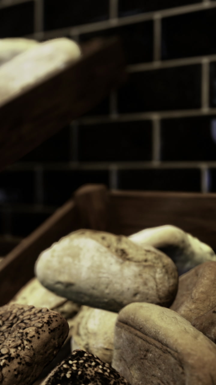 Fresh bread loaves displayed on wooden racks in a bakery setting