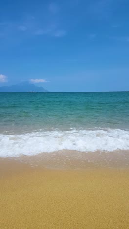 Vertical-Video,-Empty-Sandy-Beach-and-Waves-on-Hot-Sunny-Day