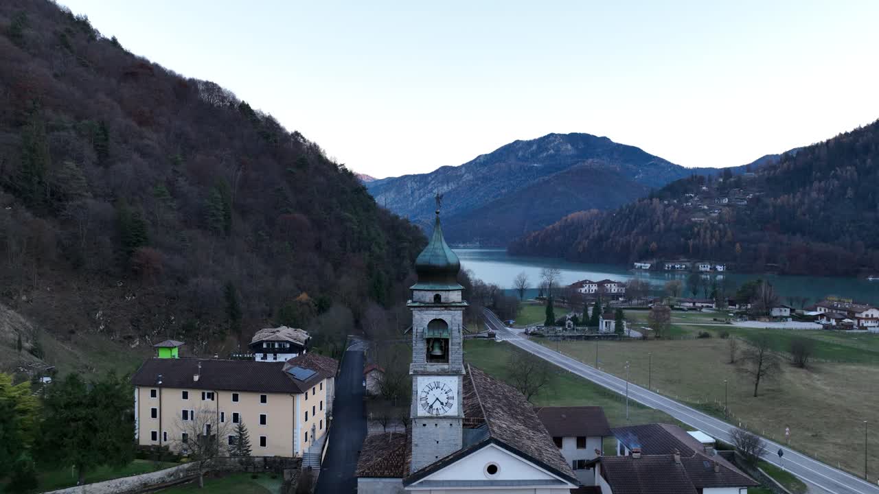 Aerial Backward Drone shot of Pieve di Ledro's Church at Ledro Lake - Not Graded
