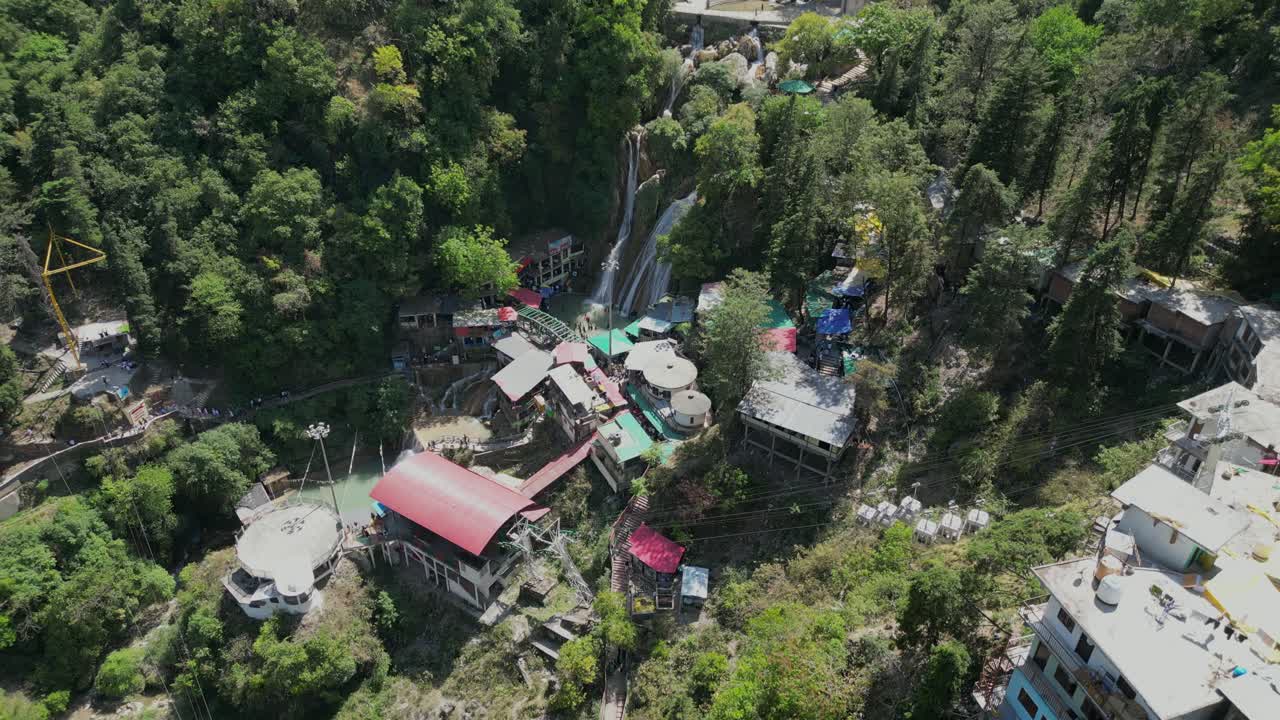 Kempty water falls in greenery hills drone moving wide to closer view in Missouri in india