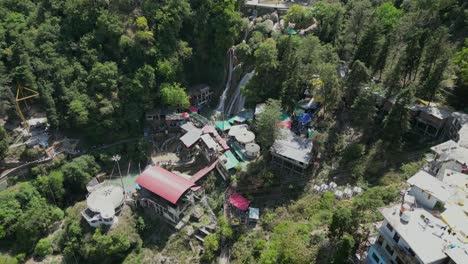 kempty water falls in greenery hills drone moving wide to closer view in missouri in india
