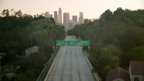 downtown los angeles skyline from the freeway at dusk