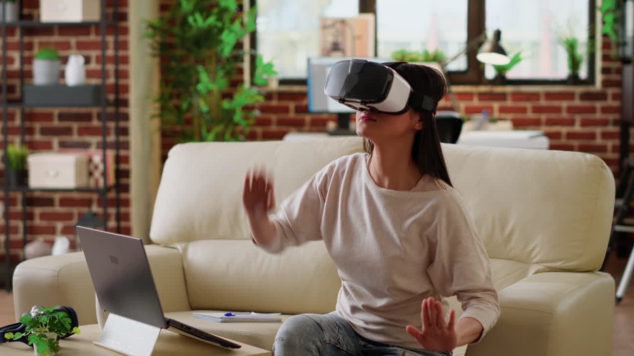 Woman using virtual reality headset at home