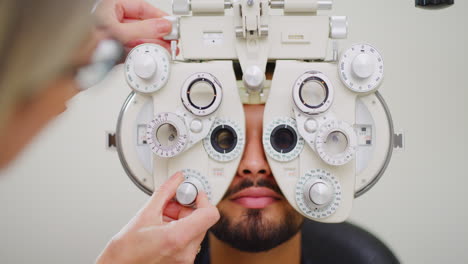 Ophthalmologist-doing-eye-test-on-male-patient