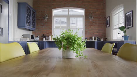 interior of open plan kitchen and dining room with table and chairs