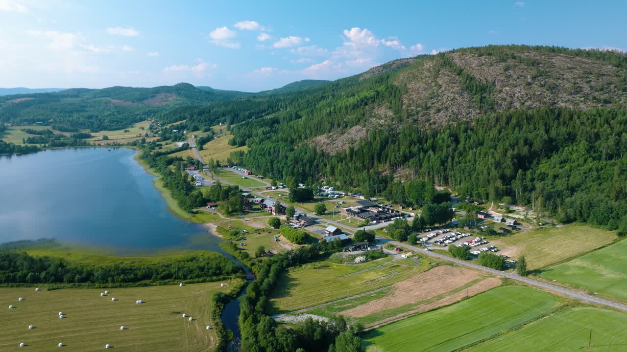 Friluftsbyn, drone push-out on sunny summer day