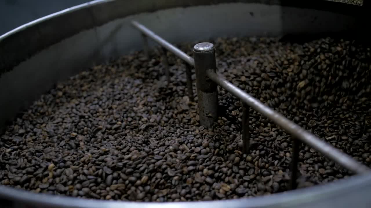 coffee beans spinning in roaster, slow motion, small Nicaraguan roaster
